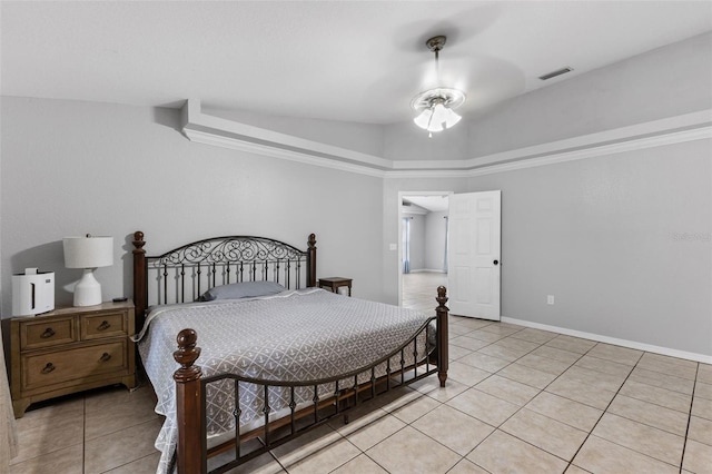 bedroom featuring light tile patterned floors and lofted ceiling