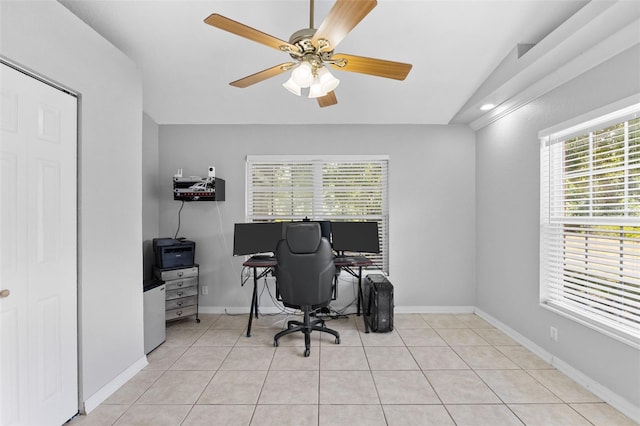 tiled office featuring vaulted ceiling, plenty of natural light, and ceiling fan