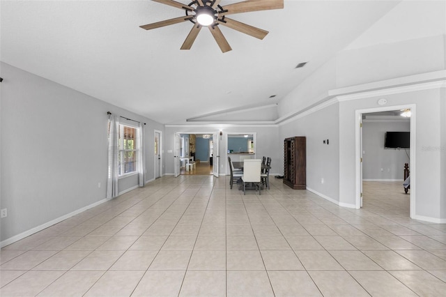 unfurnished living room featuring ceiling fan, light tile patterned flooring, and lofted ceiling