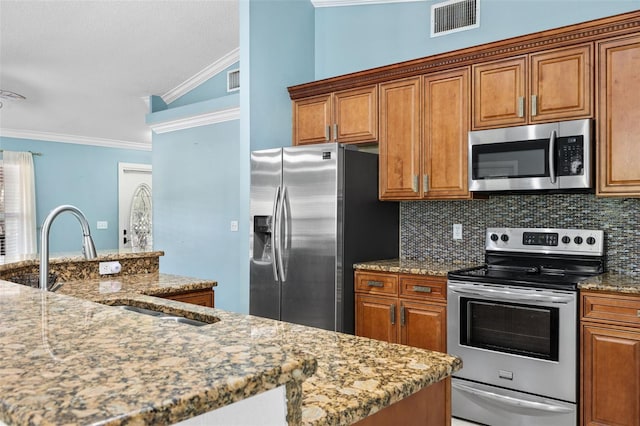 kitchen with sink, stainless steel appliances, tasteful backsplash, light stone counters, and ornamental molding