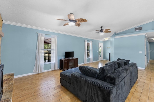 living room with ceiling fan, a healthy amount of sunlight, vaulted ceiling, and ornamental molding