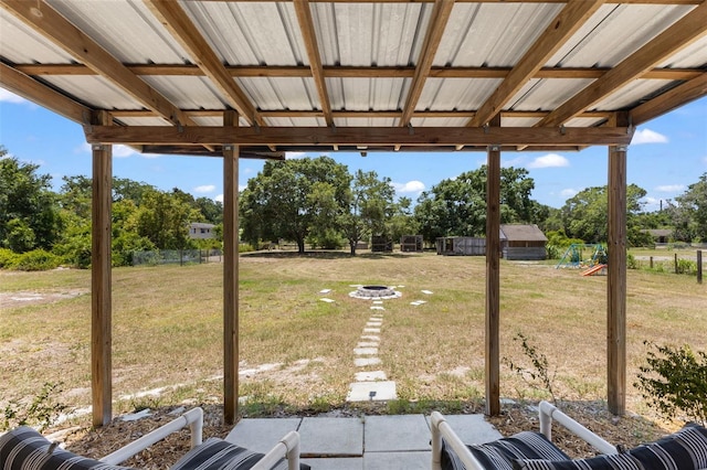 view of yard with a patio area and an outdoor fire pit