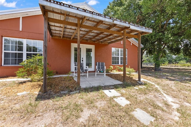 back of house with a patio area