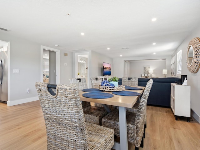 dining room featuring light hardwood / wood-style flooring