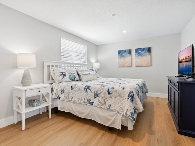 bedroom featuring light hardwood / wood-style floors