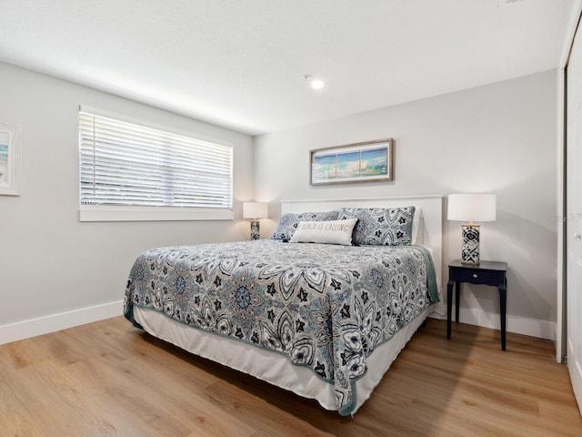 bedroom with light wood-type flooring