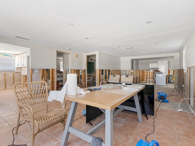 dining area featuring a textured ceiling