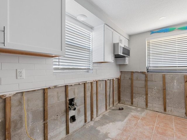 kitchen featuring white cabinetry