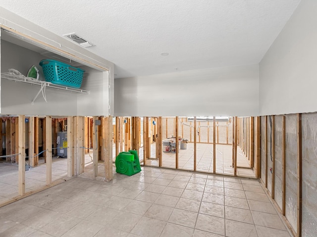 spare room featuring water heater