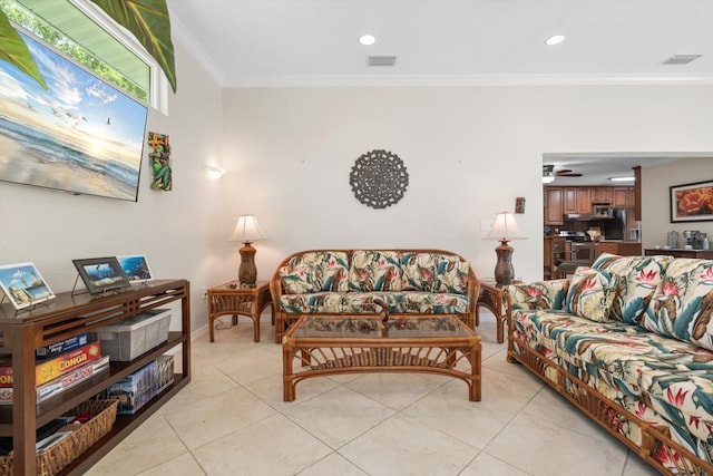 living room with ornamental molding, visible vents, ceiling fan, and light tile patterned flooring