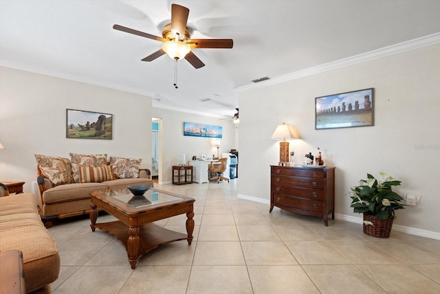 living room featuring light tile patterned floors, ornamental molding, visible vents, and baseboards