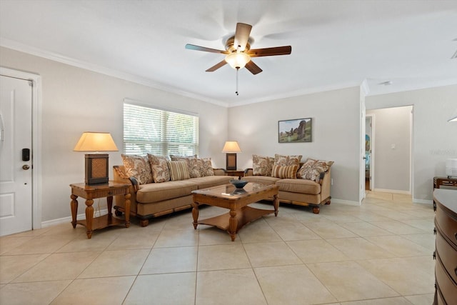 living area with light tile patterned floors, ornamental molding, a ceiling fan, and baseboards