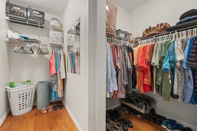 spacious closet with wood finished floors