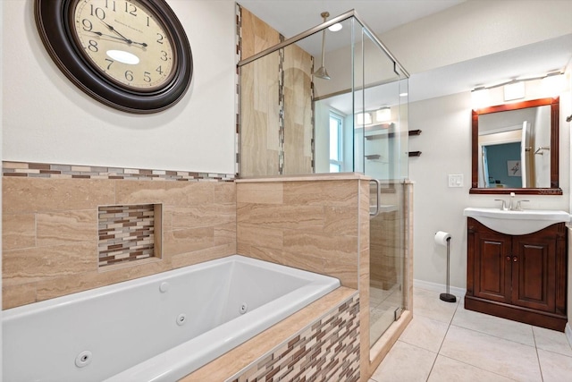 bathroom featuring a whirlpool tub, tile patterned floors, a shower stall, and vanity