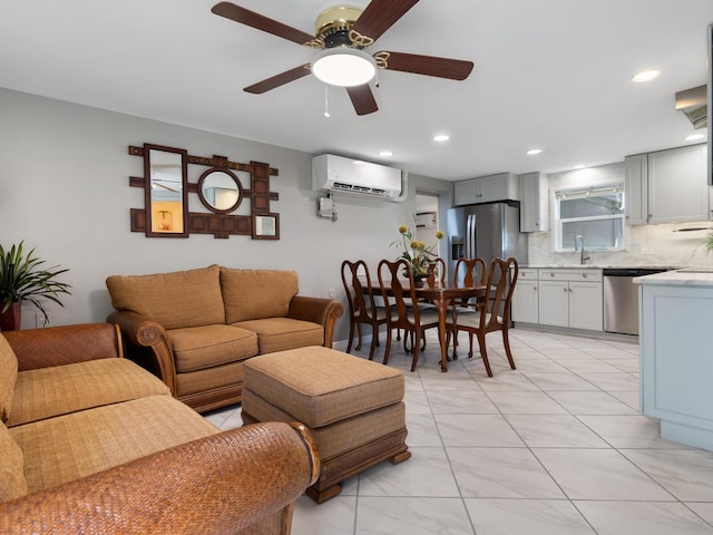 living room with ceiling fan, sink, and a wall mounted air conditioner