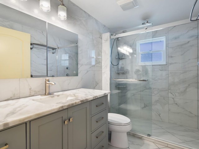 bathroom with vanity, an enclosed shower, and toilet