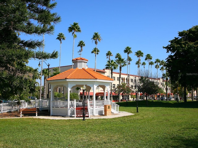 view of property's community with a lawn and a gazebo