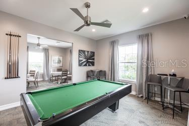 game room with carpet, billiards, and ceiling fan