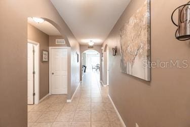 hall featuring tile patterned flooring