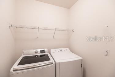 laundry room featuring separate washer and dryer