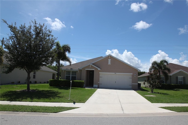 ranch-style house featuring a garage and a front yard