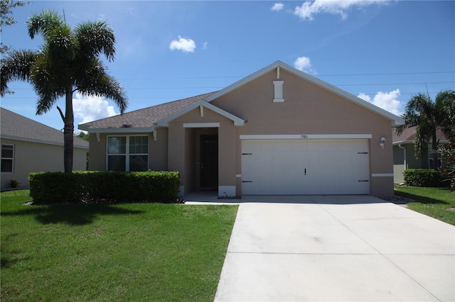 single story home featuring a garage and a front lawn