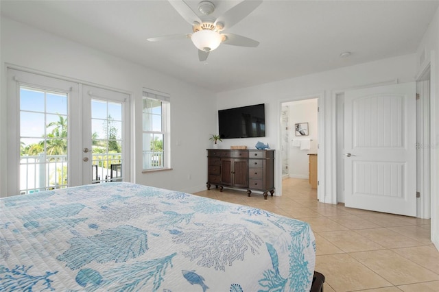 tiled bedroom featuring ceiling fan, access to exterior, french doors, and ensuite bathroom