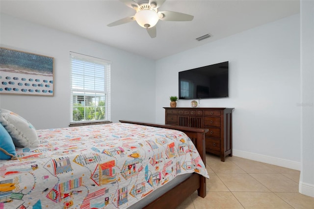 bedroom with ceiling fan and light tile patterned flooring