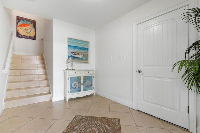 foyer entrance with light tile patterned floors