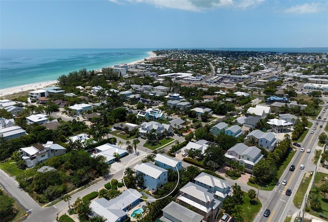 bird's eye view with a residential view, a view of the beach, and a water view