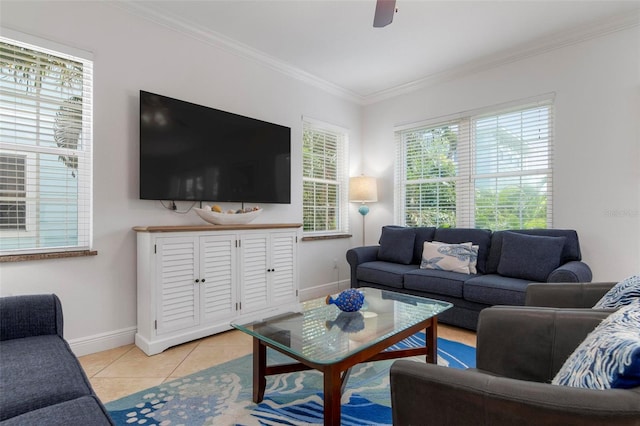 living room featuring light tile patterned floors, baseboards, ornamental molding, and ceiling fan