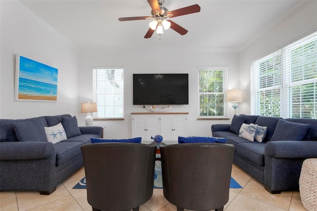 living area with plenty of natural light, ornamental molding, and a ceiling fan