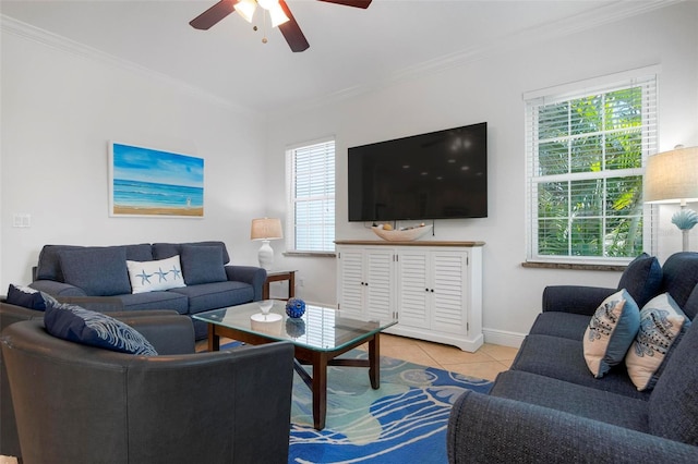 tiled living area featuring a ceiling fan, baseboards, and ornamental molding