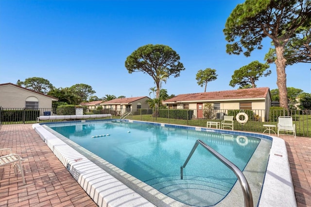 view of swimming pool featuring a patio area