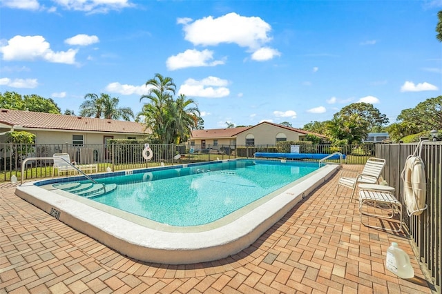 view of swimming pool with a patio