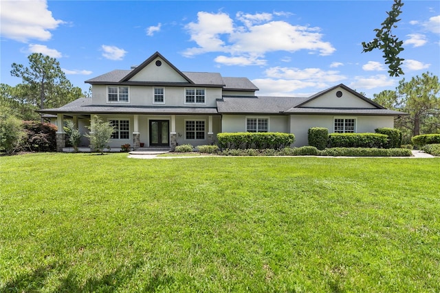 view of front of home featuring covered porch and a front lawn