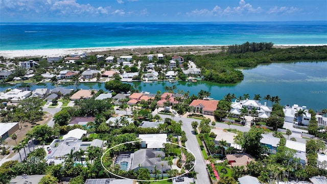 bird's eye view featuring a water view and a view of the beach