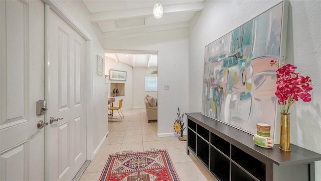 hall with light tile patterned floors and lofted ceiling with beams