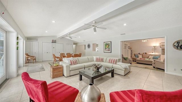 tiled living room featuring vaulted ceiling with beams, ceiling fan, and a textured ceiling