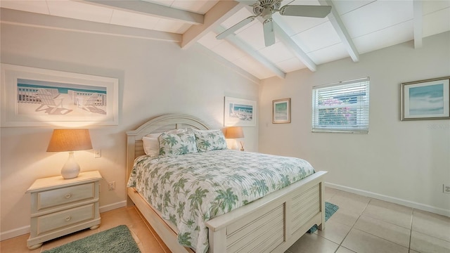 tiled bedroom with lofted ceiling with beams and ceiling fan