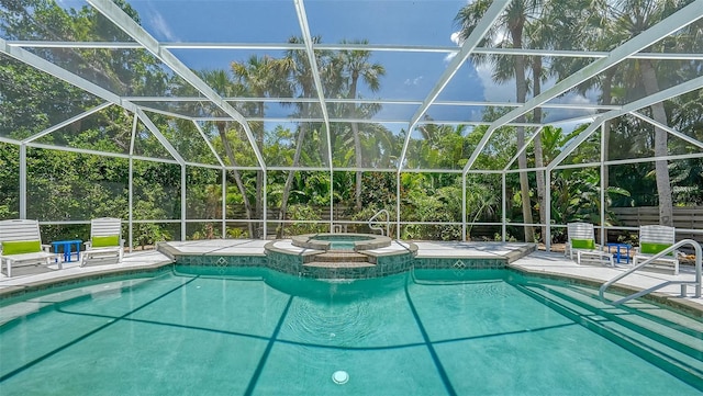 view of pool featuring a patio area, a lanai, and an in ground hot tub