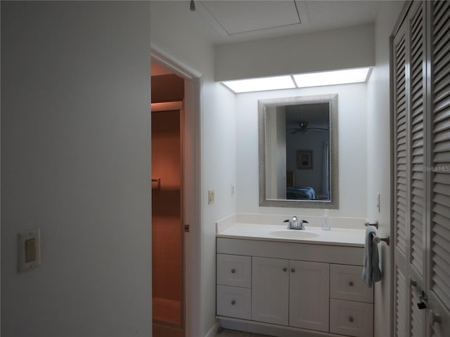 bathroom with ceiling fan and vanity