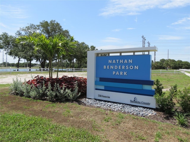 community sign with a water view