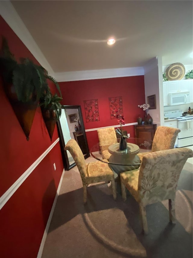 view of carpeted dining area