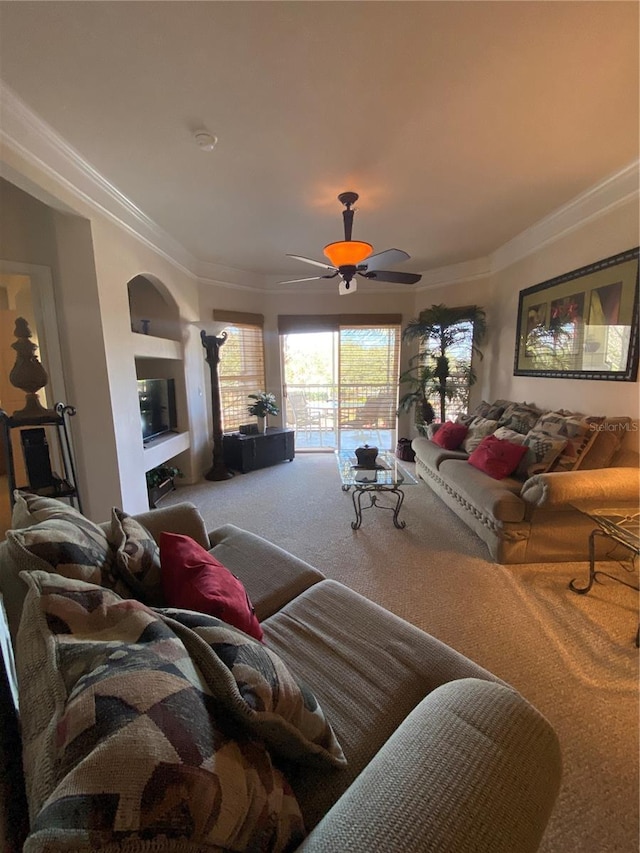 living room featuring ceiling fan, carpet flooring, and ornamental molding