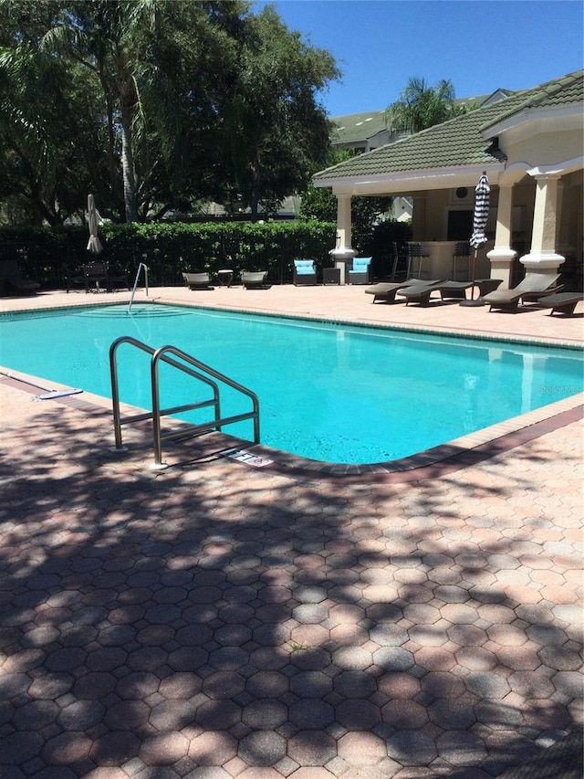 view of pool featuring a patio area