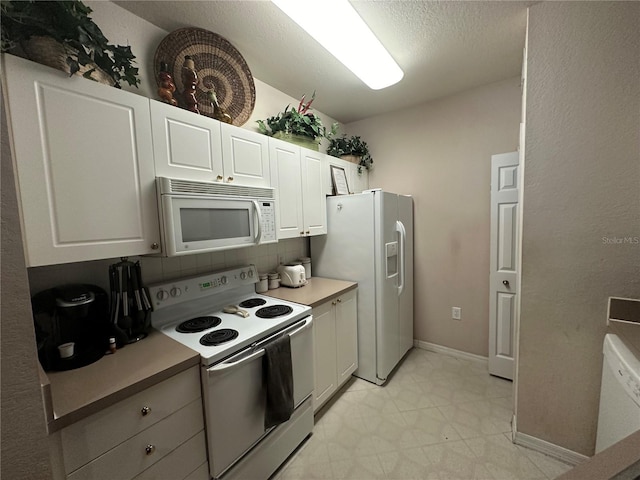 kitchen with white cabinetry, tasteful backsplash, white appliances, and light tile patterned floors