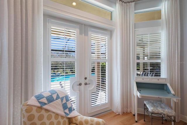 entryway featuring light hardwood / wood-style flooring and french doors