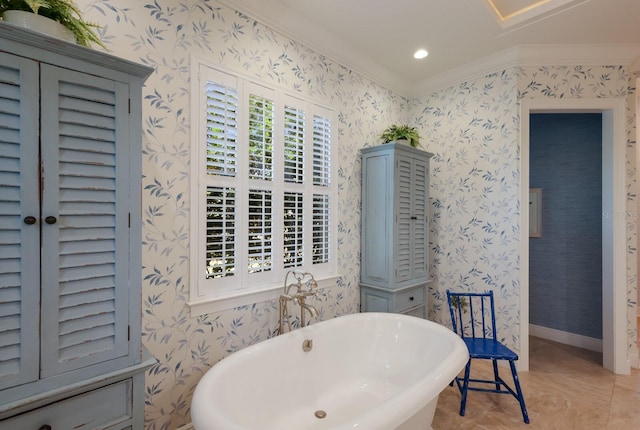 bathroom with a tub to relax in, tile patterned floors, and crown molding