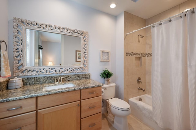 full bathroom with vanity, toilet, and shower / bath combo with shower curtain